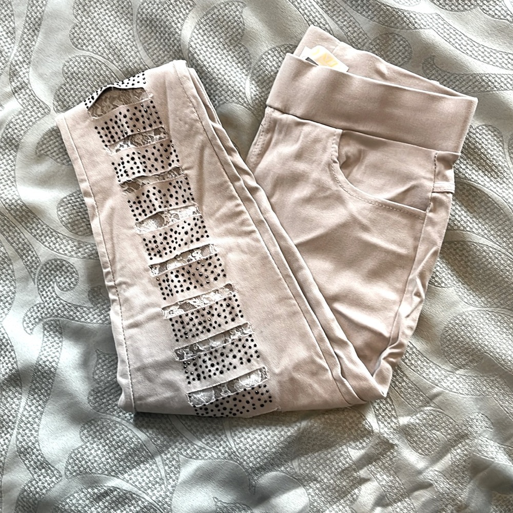 Gray stud and lace distressed jeggings.